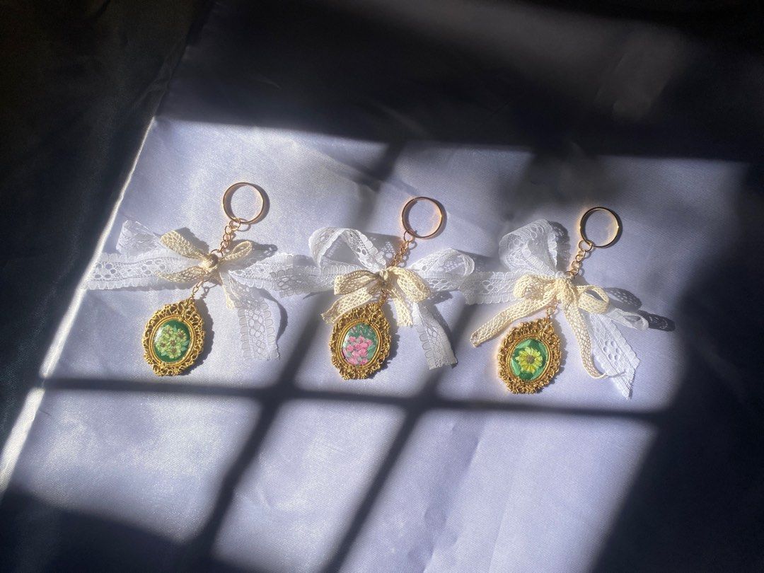 Coquette keychains (Sold per piece) (Category: Charms) located in Meycauayan. Submitted by tinpatchouli (Listing ID 1339608273, Image 1). Description: Available: Sunflowers painting pendant 1 Sunflower painting pendant.
