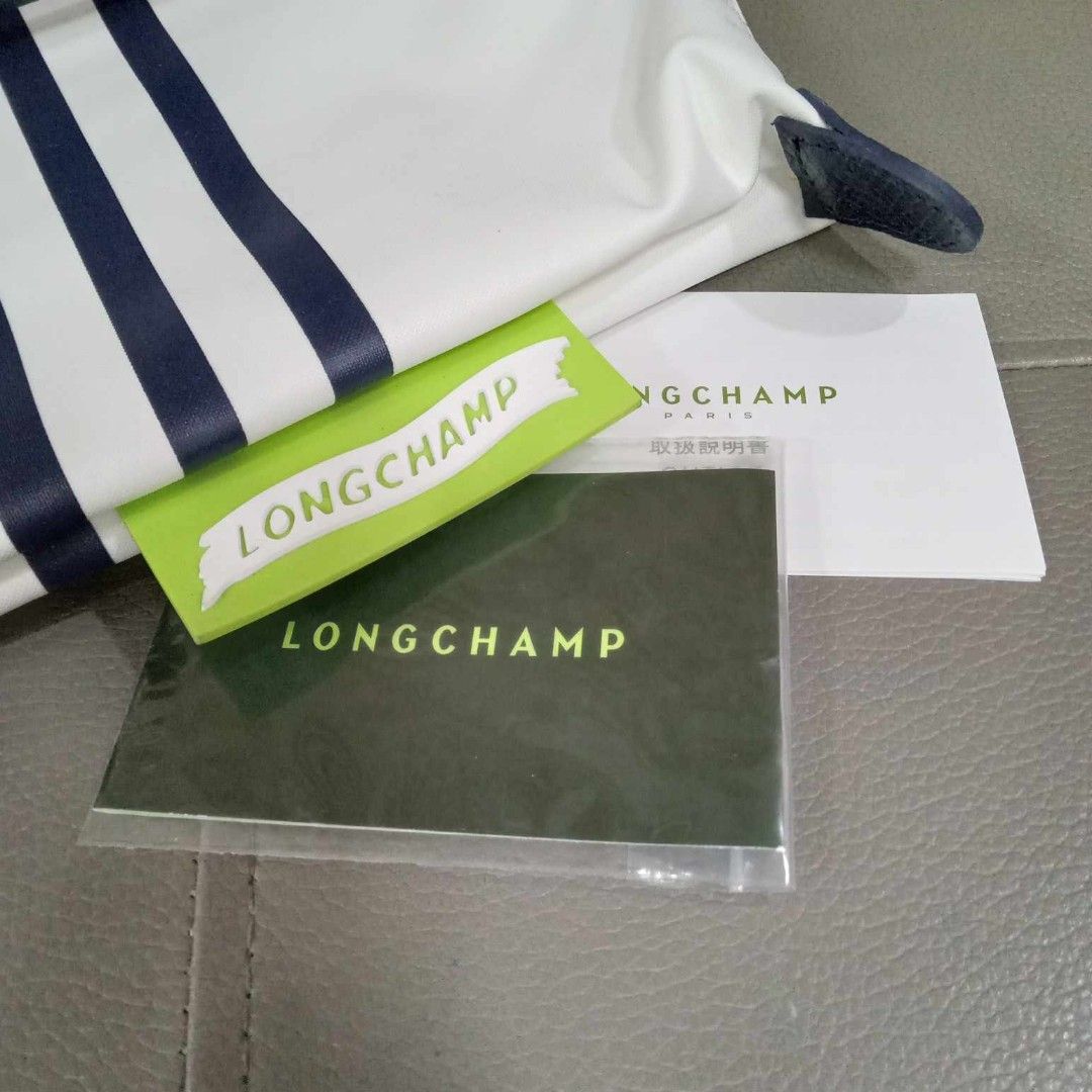 Longchamp Medium Nylon Tote (Category: Luxury Bags & Wallets) located in Taguig. Submitted by esa.agustin (Listing ID 1339623643, Image 3). Description: Original Longchamp medium white with blue stripes tote bag. With carecards..