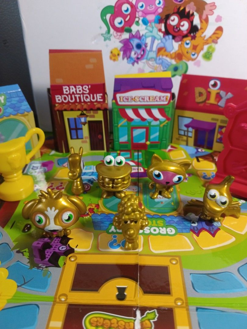 📍Moshi Monsters -Monstro City Game (Category: Kids Toys) located in Las Pinas. Submitted by mommy_14 (Listing ID 1339677850, Image 3). Description: 📍Moshi Monsters -Monstro City Game 📍Race around monstro city collecting items from the shops and answering questions along the way. 📍Game contens: - 1 game board - 6 monster playing pieces (replaced) -1 die - 1 trophy (replaced) - 1 treasure chest - 6 bookshelf unit (complete) - 24 shop items (com