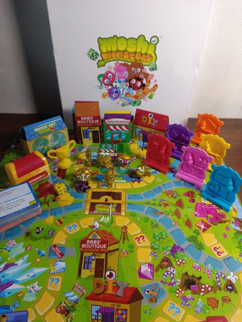 📍Moshi Monsters -Monstro City Game (Category: Kids Toys) located in Las Pinas. Submitted by mommy_14 (Listing ID 1339677850, Image 2). Description: 📍Moshi Monsters -Monstro City Game 📍Race around monstro city collecting items from the shops and answering questions along the way. 📍Game contens: - 1 game board - 6 monster playing pieces (replaced) -1 die - 1 trophy (replaced) - 1 treasure chest - 6 bookshelf unit (complete) - 24 shop items (com
