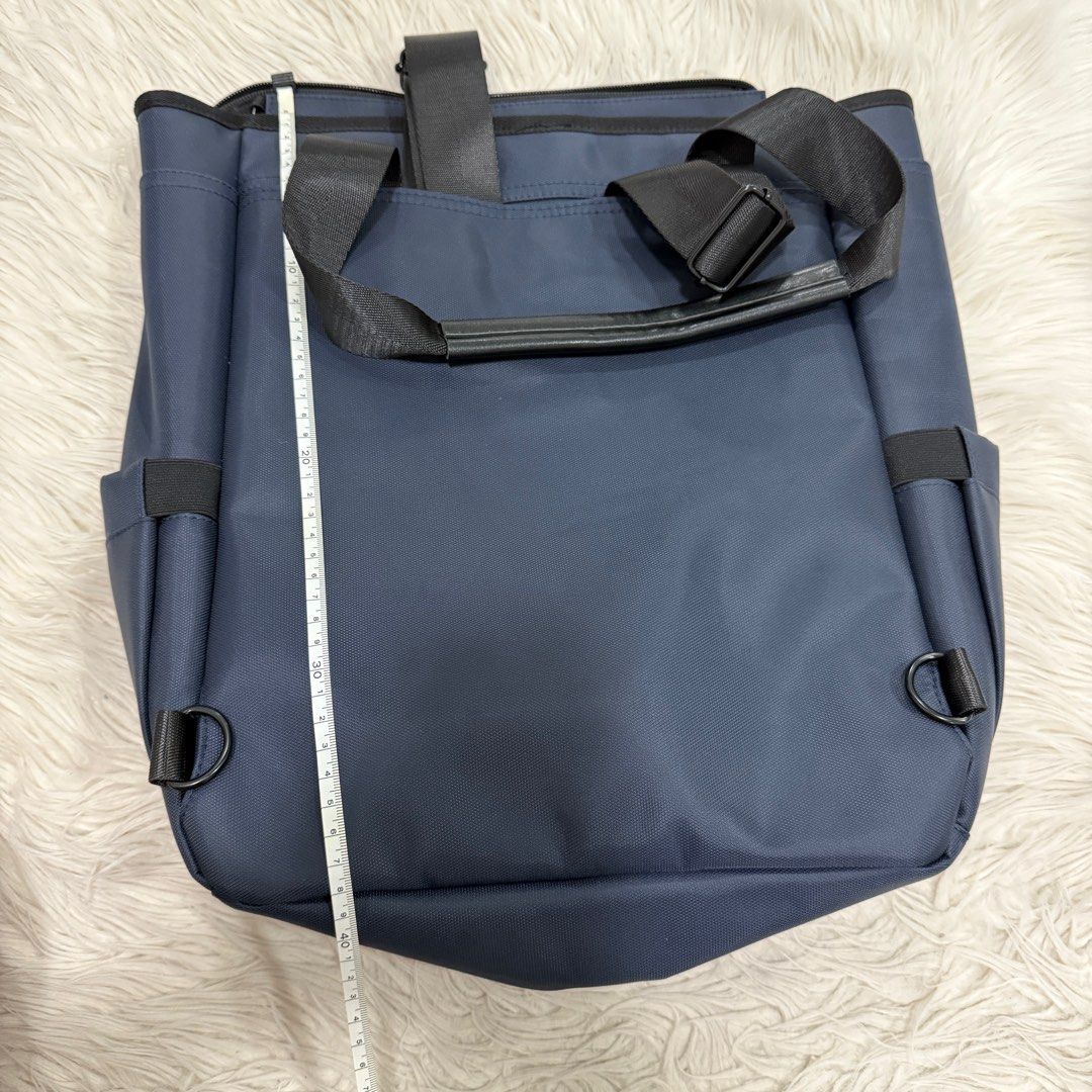 Backpack (Category: Backpacks) located in Singapore. Submitted by k00lsheep (Listing ID 1344457188, Image 8). Description: Backpack Brand NEW Not used at all Versatile backpack with dual carrying options: • The backpack sling can be neatly tucked into the back compartment. (Picture 3) • Features multiple compartments, including a dedicated laptop section. (Picture 5) • Both sides come with dual slots for added storage. Dimensions: • Length: 39cm 