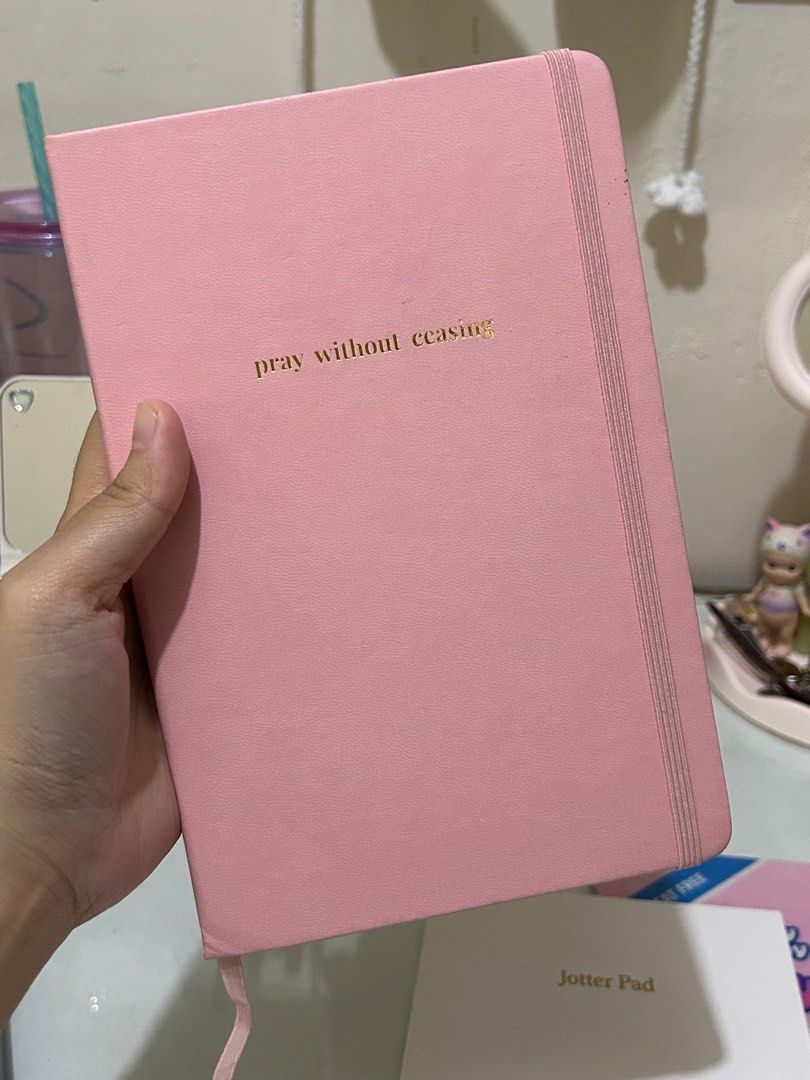 [BUNDLE] Prayer Journal (blank) and Jotter Pad (blank) (Category: Stationery & School Supplies) located in Lipa City. Submitted by namjooniefy (Listing ID 1344466879, Image 2). Description: Sold as a bundle for P280.00 with minimal stain on the covers, but no issues on the paper itself. RFS: extra notebooks / declutterring MOP: gcash / seabank MOD: j&t direct .