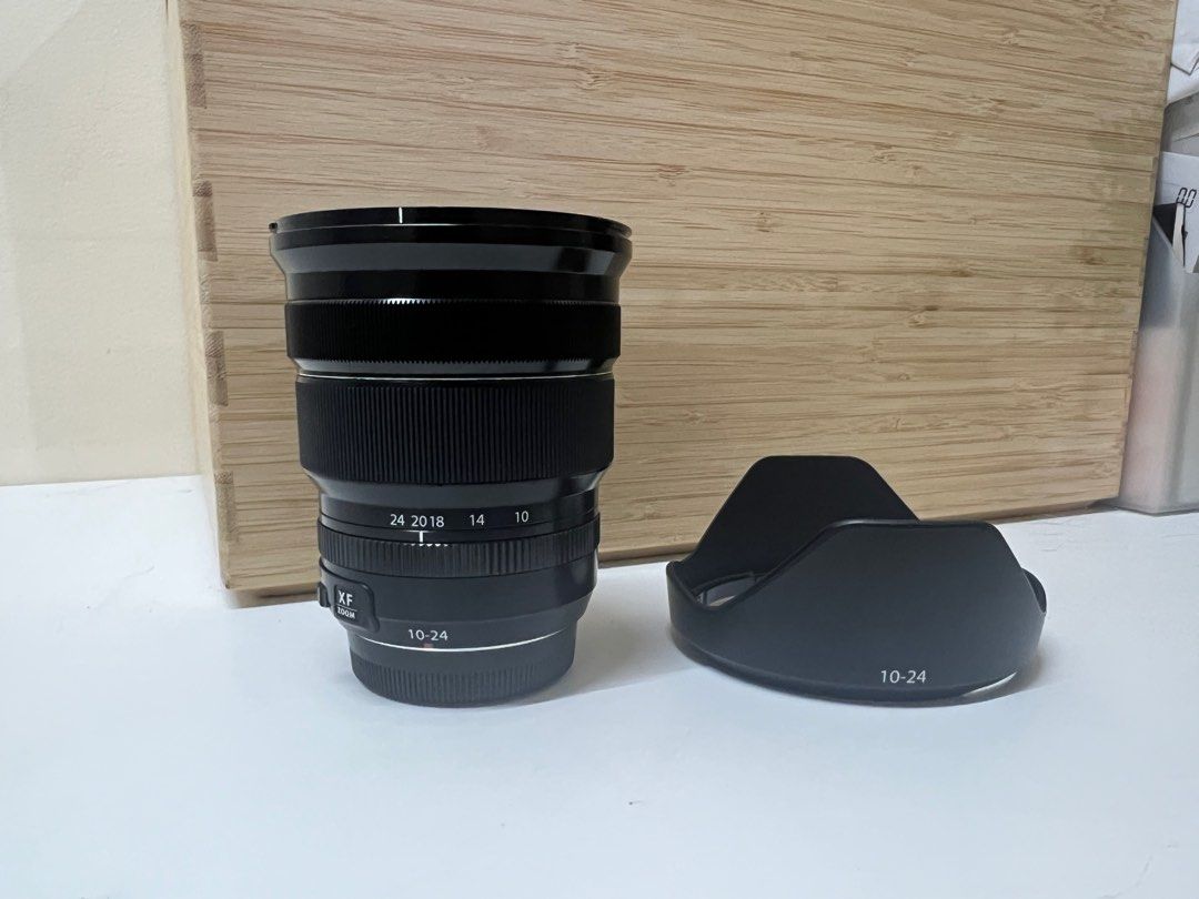 Fuji XF10-24mm (Category: Lens & Kits) located in Taguig. Submitted by studio26 (Listing ID 1344436446, Image 1). Description: PLEASE READ THE ENTIRE POST TO SEE ANSWERS TO COMMON QUESTIONS Fuji 10-24mm Hood, cap, and rear cover are all original. Hardly used. Used only for a few test shots. Kept in a dry box. Like new, no scratches No more box. LOCATION Taguig PAYMENT Cashless payment only. GCash or BPI. DELIVERY To be arranged and shouldered by 