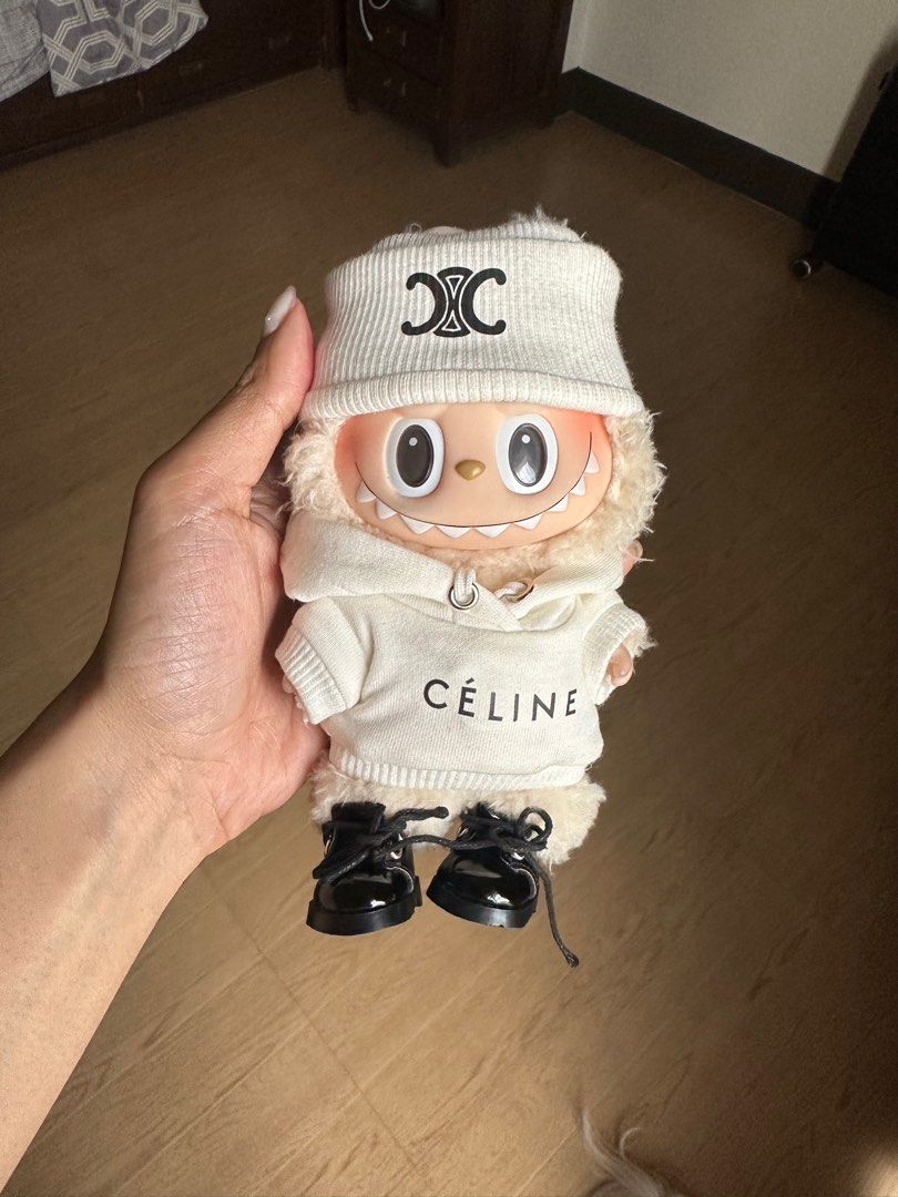 Labubu V1 (Soymilk ) (Category: Designer & Blind Box Toys) located in Antipolo. Submitted by ivychillz (Listing ID 1344509078, Image 1). Description: Selling my Labubu Soymilk with Celine Apparel. Doll only. The card is misplaced :( No more box & foil too Check second photo the eyebrows have a bit of a stain but not that noticeable. Been hiding it so I bought the Celine beanie. RFS: Losing sparks for my collectibles .