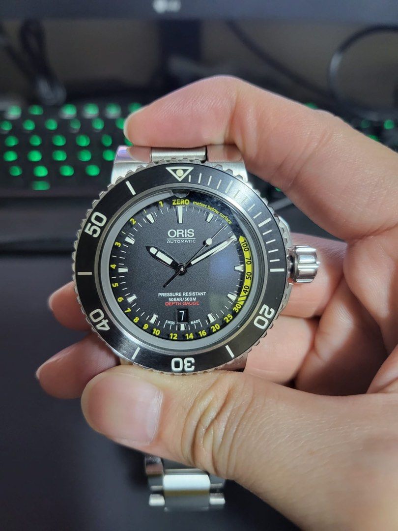 Oris Depth Gauge (Category: Watches) located in Singapore. Submitted by ecto123 (Listing ID 1344456607, Image 1). Description: Beautiful watch in immaculate condition. Just serviced with Oris in early 2024. Full set available and do stay tuned for more photos. Will rate this piece 9.5/10 cos it seldom sees wrist time due to other watches which I rotate daily. Very good wrist presence and interesting piece as it tells how deep you are diving. Thou