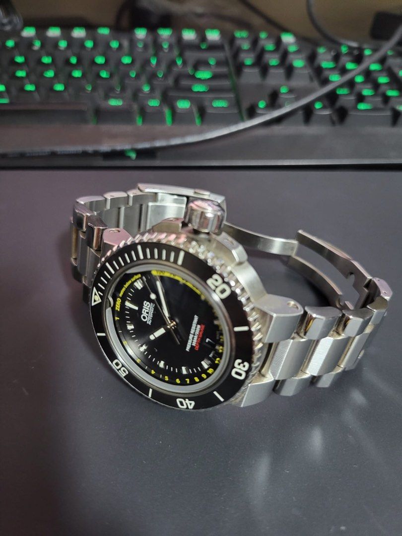 Oris Depth Gauge (Category: Watches) located in Singapore. Submitted by ecto123 (Listing ID 1344456607, Image 3). Description: Beautiful watch in immaculate condition. Just serviced with Oris in early 2024. Full set available and do stay tuned for more photos. Will rate this piece 9.5/10 cos it seldom sees wrist time due to other watches which I rotate daily. Very good wrist presence and interesting piece as it tells how deep you are diving. Thou