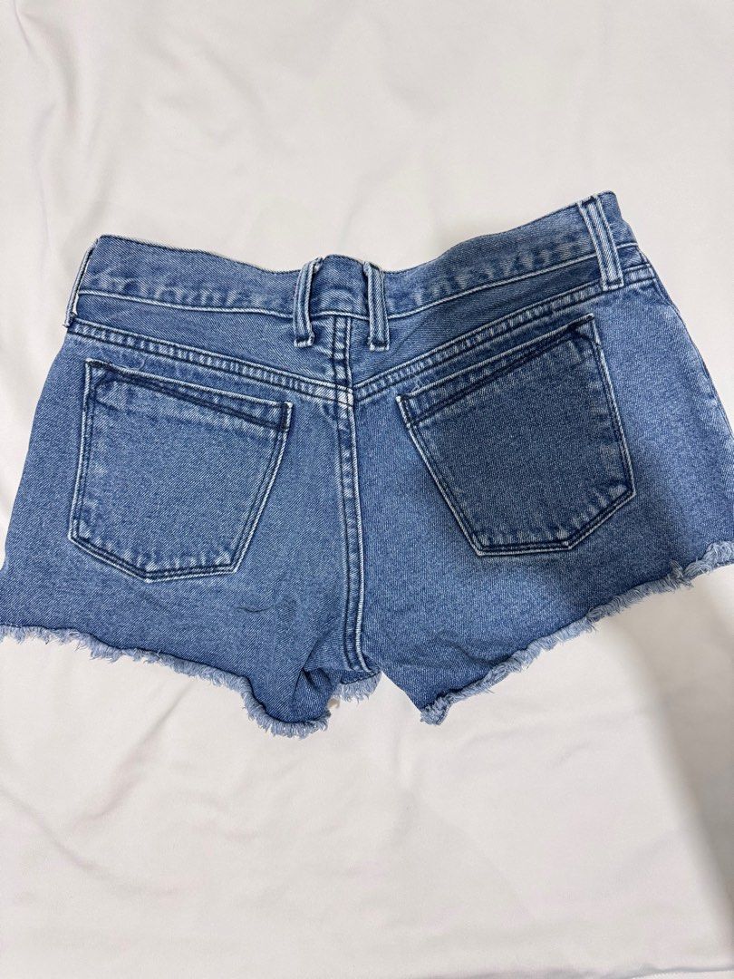 [Preloved] Low-waisted Ripped Denim Shorts (Category: Shorts) located in Bacoor. Submitted by amorousmnl (Listing ID 1344531896, Image 3). Description: Good condition; no issues Size: S-M Exact Measurements: Bottom Waist: 30" Hips: 32" Thigh: 20" Length: 10" RFS: Declutter.