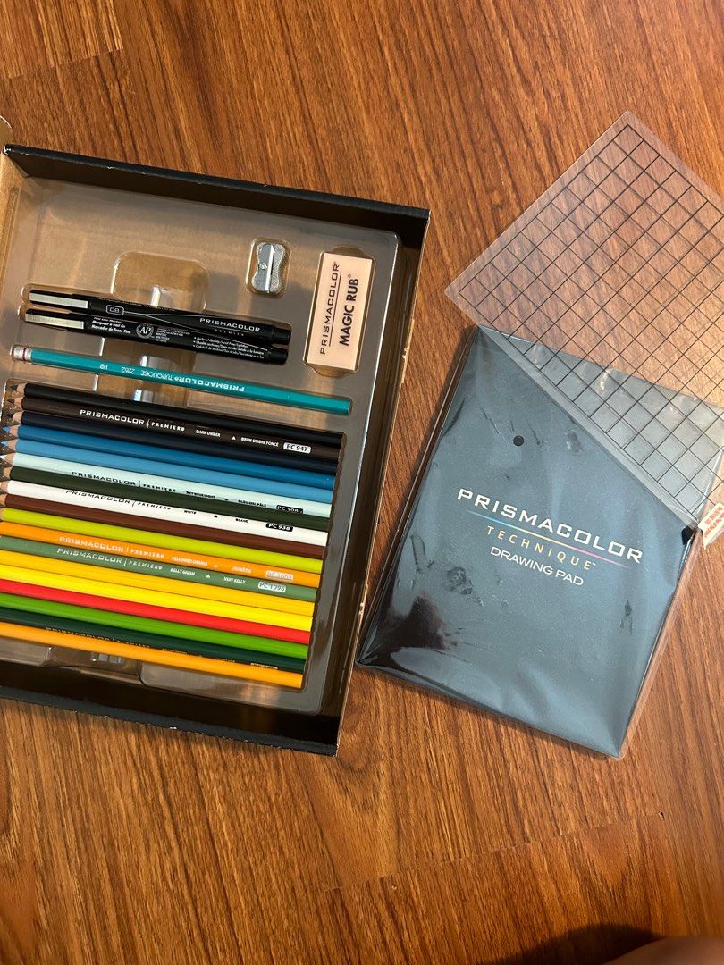 Prismacolor Technique Box Set (Category: Craft Supplies & Tools) located in Quezon City. Submitted by skzmnh (Listing ID 1344656723, Image 2). Description: set includes: - 18 colored pencils - 2 illustration markers - 1 clear grid overlay - 1 drawing pad - 1 magic rub eraser never used but box is kinda worn out from shipping issues - 1 mini sharpener - 1 graphite pencil.
