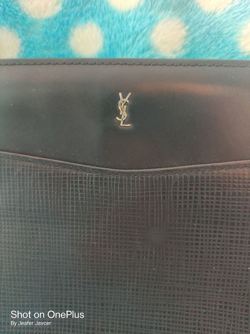 YSL clutch bag (Category: Luxury Bags & Wallets) located in Baguio. Submitted by ferns_garage.0924 (Listing ID 1344669921, Image 2). Description: vintage type YSL clutch bag with tag 3 compartments zipper tested working sign of usage, barely noticeable flaw scan pics for reference and other details wysiwyg, buy as it is MOP GCASH location Baguio the seller is not liable for any damage or loss of the item due to mishandling of the courier..