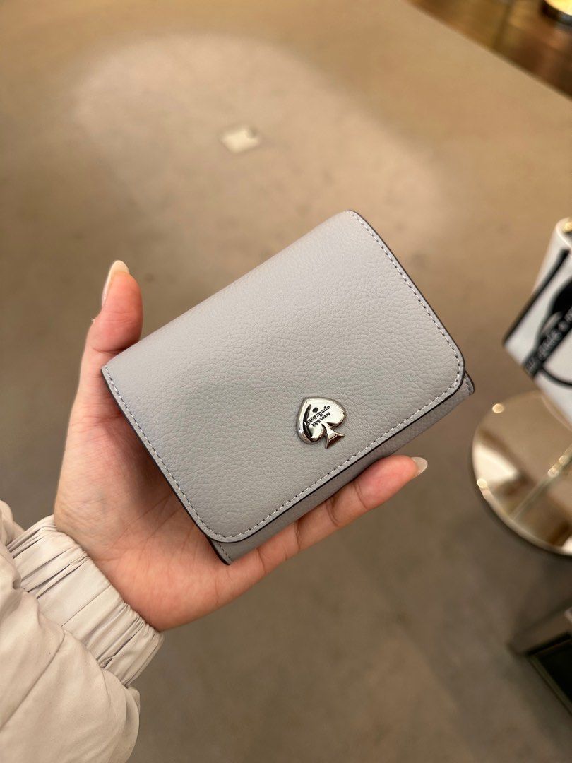 Used kate oxygenating spade wallets