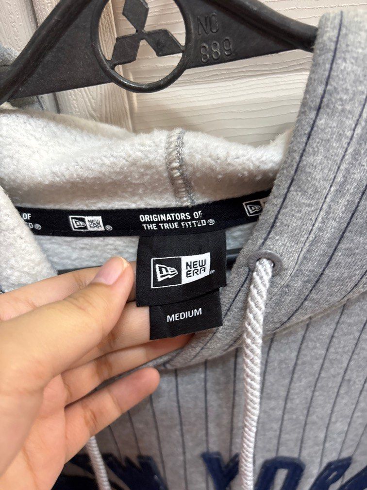 New Era Hoodie Jacket (Category: Coats, Jackets and Outerwear) located in Pasig City. Submitted by ez_declutterz (Listing ID 1339756154, Image 3). Description: Still in excellent condition. Barely used. Just stored. Medium on Tag. No flaws. Fits medium to large body frame. For reference owner is 5’7”, 70kg.
