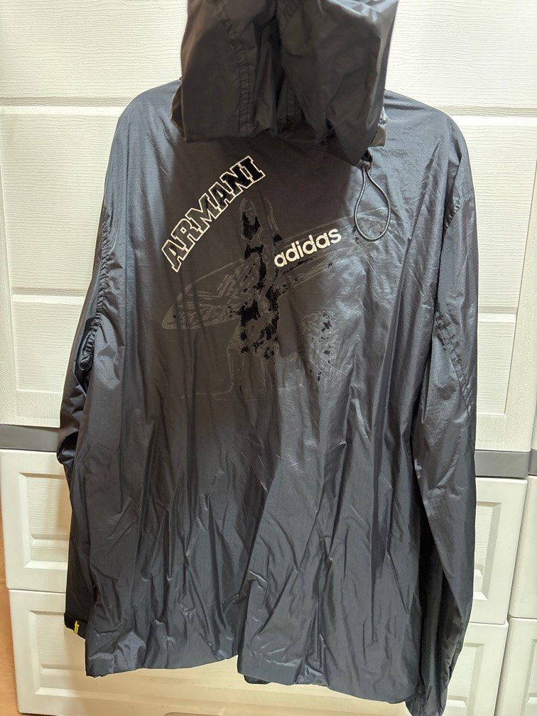 Original Adidas Jacket - Adidas x Armani (Category: Coats, Jackets and Outerwear) located in Pasig City. Submitted by ez_declutterz (Listing ID 1339754815, Image 2). Description: Please see picture for flaw. Generally okay, nabakbak lang yung parang suede na print sa likod. Zipper is good. Other parts are still in good condition. XL on tag, women..