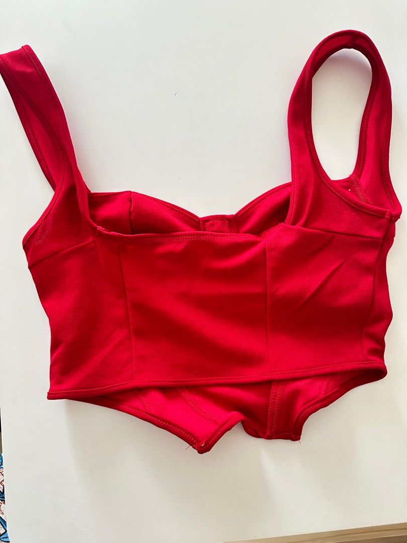 Red Sleeveless Top Corset with boning (Category: Sleeveless) located in Bayombong. Submitted by chie_3030 (Listing ID 1339767765, Image 2). Description: Used during the Halloween for Little Red Riding Hood costume. See photos at the end. The black skirt and the cape are also on sale! Black skirt - 170 Red hood/cape - 130.