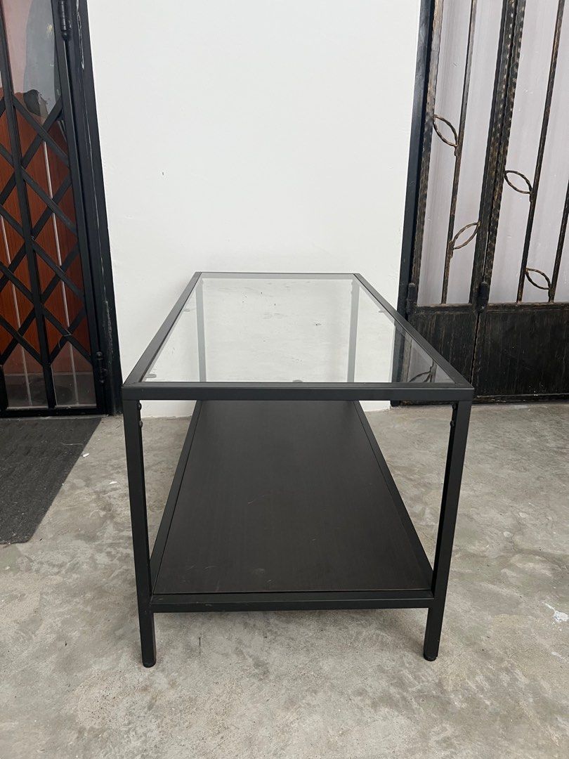 Coffee Table (Category: Tables & Sets) located in Singapore. Submitted by madnugget (Listing ID 1340073142, Image 2). Description: Well Used Coffee Table, Table top With Clear Glass, Bottom Shelf with laminated board Arrange your own delivery..