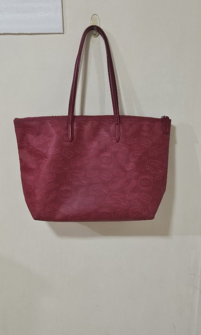 LACOSTE Zipped Shopping bag (red) (Category: Shoulder Bags) located in Pasig City. Submitted by declutteringcart (Listing ID 1340027425, Image 2). Description: LACOSTE Zipped Shopping bag (red) **LAST PRICE POSTED na po to save both our time **first to pay gets the item / no reservation **kindly check all photos for the condition.