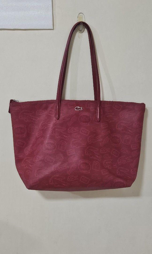 LACOSTE Zipped Shopping bag (red) (Category: Shoulder Bags) located in Pasig City. Submitted by declutteringcart (Listing ID 1340027425, Image 1). Description: LACOSTE Zipped Shopping bag (red) **LAST PRICE POSTED na po to save both our time **first to pay gets the item / no reservation **kindly check all photos for the condition.