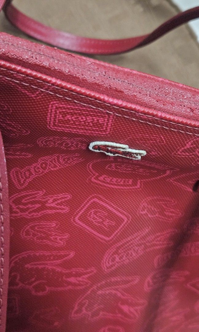 LACOSTE Zipped Shopping bag (red) (Category: Shoulder Bags) located in Pasig City. Submitted by declutteringcart (Listing ID 1340027425, Image 3). Description: LACOSTE Zipped Shopping bag (red) **LAST PRICE POSTED na po to save both our time **first to pay gets the item / no reservation **kindly check all photos for the condition.