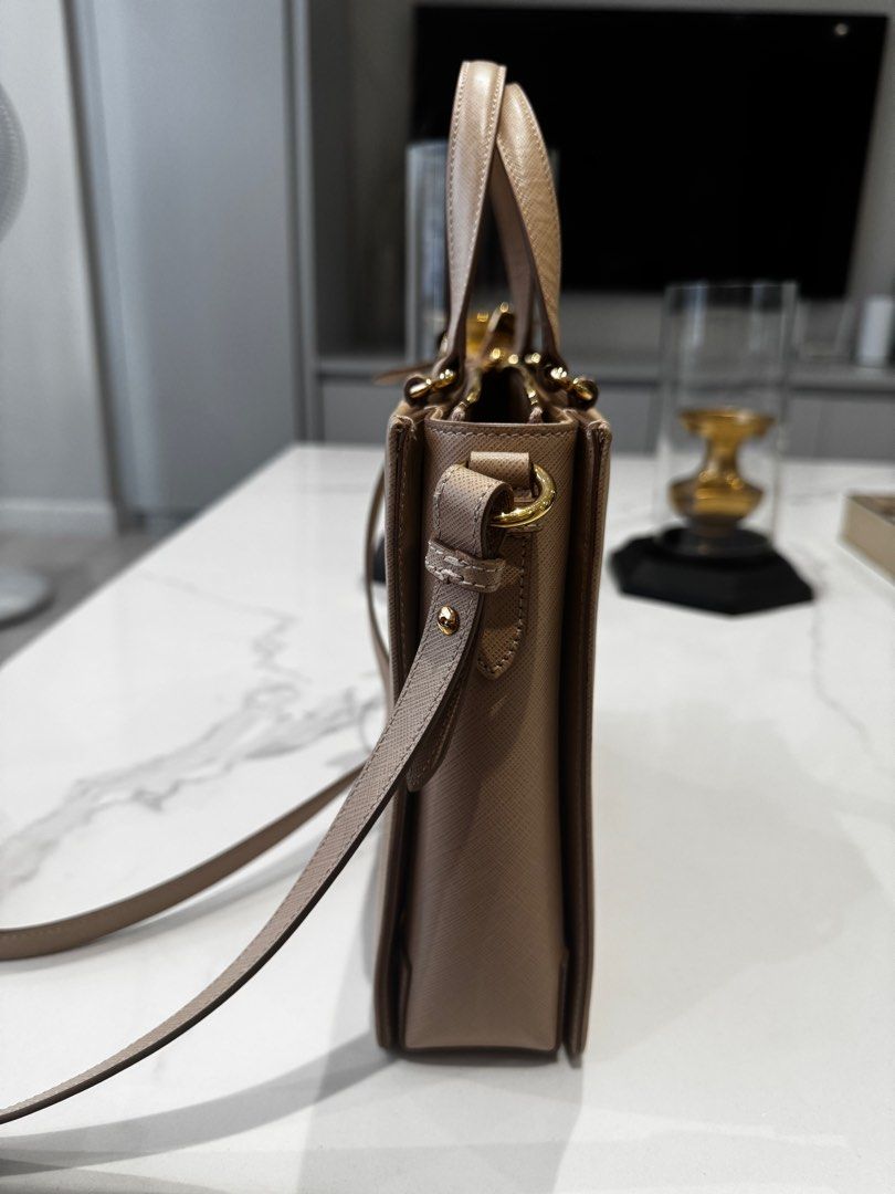 Salvatore Ferragamo Tracy Bag (Category: Luxury Bags & Wallets) located in Manila. Submitted by joanne727 (Listing ID 1339996546, Image 2). Description: Salvatore Ferragamo Model: Tracy Color: Beige Condition: used just once for half a day. No issues. Like brand new. Inclusion: dust bag Guaranteed authentic bought from duty free for $1520. Lightweight. Has 3 inner compartments. RFS: have the same color and size bag only in different brand. Declut