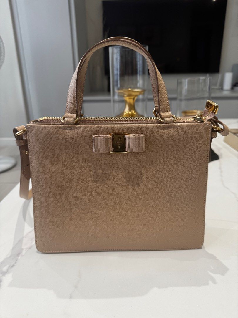 Salvatore Ferragamo Tracy Bag (Category: Luxury Bags & Wallets) located in Manila. Submitted by joanne727 (Listing ID 1339996546, Image 1). Description: Salvatore Ferragamo Model: Tracy Color: Beige Condition: used just once for half a day. No issues. Like brand new. Inclusion: dust bag Guaranteed authentic bought from duty free for $1520. Lightweight. Has 3 inner compartments. RFS: have the same color and size bag only in different brand. Declut