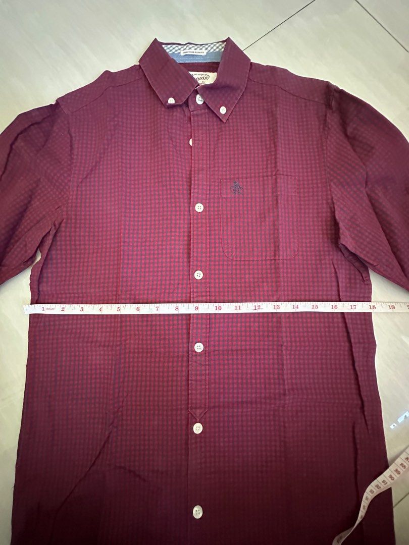 Authentic Penguin Button Down Long Sleeves (Category: Formal Shirts) located in Pasig City. Submitted by mrdecluttering_ph (Listing ID 1340119731, Image 3). Description: Authentic Penguin Long Sleeves Checkered Maroon XS Bought in Penguin Store Rfs decluttering Negotiable Shipping fee c/o buyer.