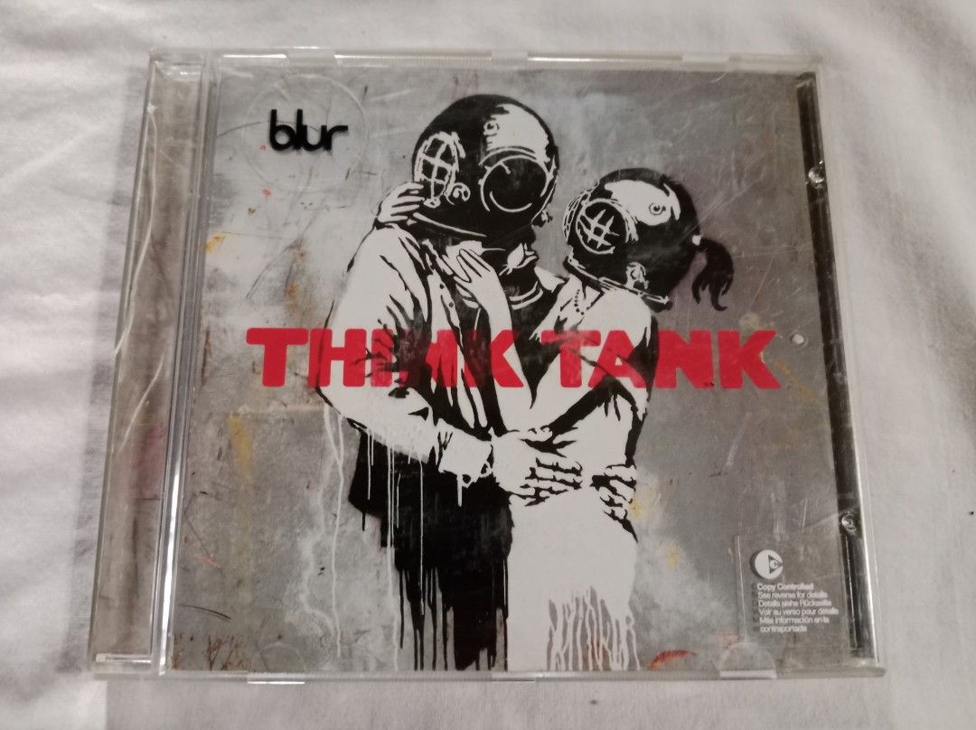 Blur - Think Tank Art Rock CD 2003 (Category: CDs & DVDs) located in Rizal. Submitted by wsted_rcords2025 (Listing ID 1340284979, Image 1). Description: Think Tank is the seventh studio album by the English rock band Blur, released on 5 May 2003. Continuing the jam-based studio constructions of the group's previous album, 13 (1999), the album expanded on the use of sampled rhythm loops and brooding, heavy electronic sounds. There are also heavy i