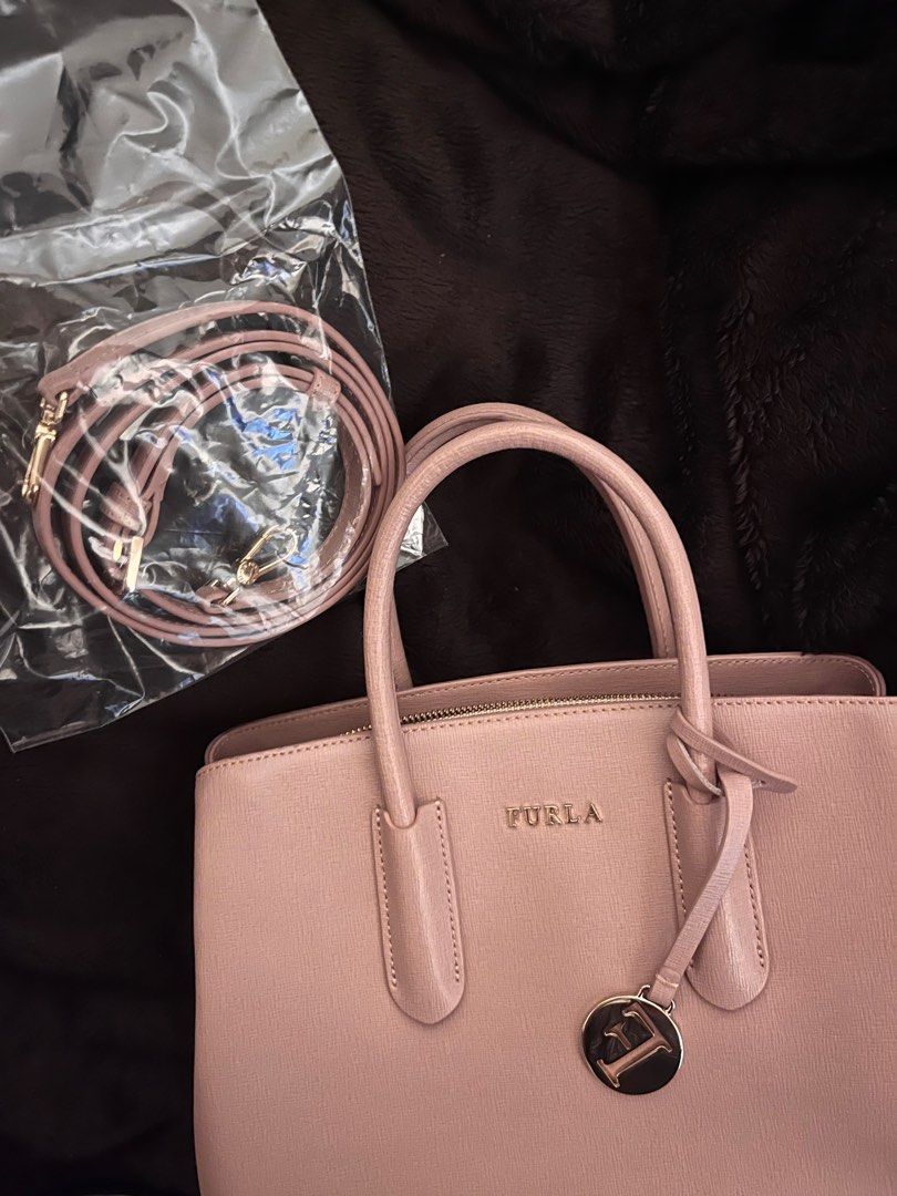 Furla Tessa Medium Two-Way Bag - Excellent Condition (Category: Luxury Bags & Wallets) located in Manila. Submitted by myday1101 (Listing ID 1340265722, Image 1). Description: Furla Tessa Medium Two-Way Bag - Elegant Light Pink (manage expectations due to lighting) Material: Genuine Saffiano Leather (durable and scratch-resistant) - Two-way design: Top handles for hand-carry and detachable strap for shoulder wear. - Spacious interior with triple 