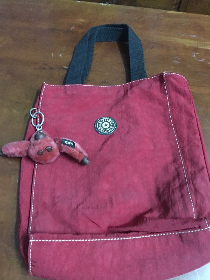 Kipling authentic (Category: Tote Bags) located in Kuala Lumpur. Submitted by lara2017 (Listing ID 1340269462, Image 2). Description: Kipling authentic.material nylon.warna red.beg masih bagus dan baik.Tiada lubang Tiada koyak.tinggi 29cm lebar 7cm panjang 21cm.