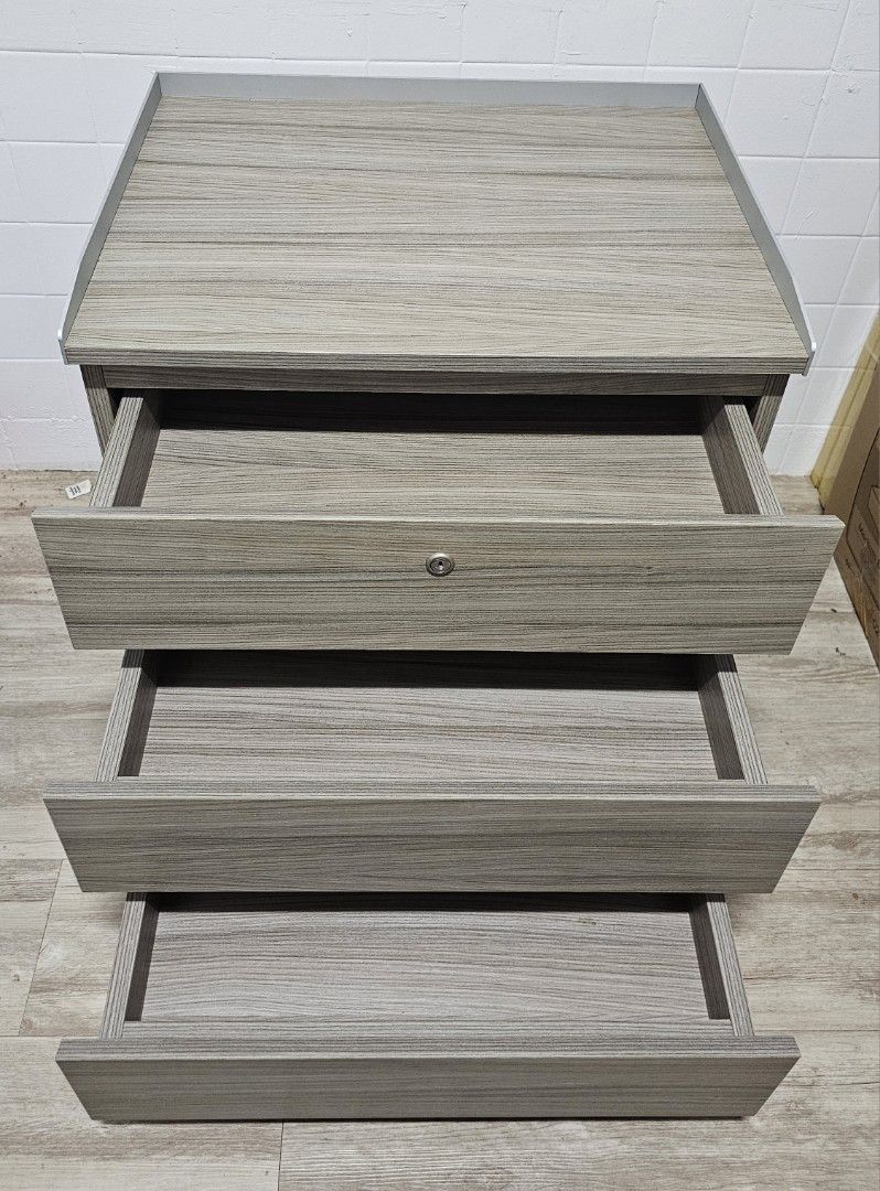 Bedside Table (Category: Shelves, Cabinets & Racks) located in Singapore. Submitted by don.deguzman.25 (Listing ID 1340465602, Image 2). Description: Laminated drawer cabinet Length - 60cm Width - 48cm Height - 67cm.