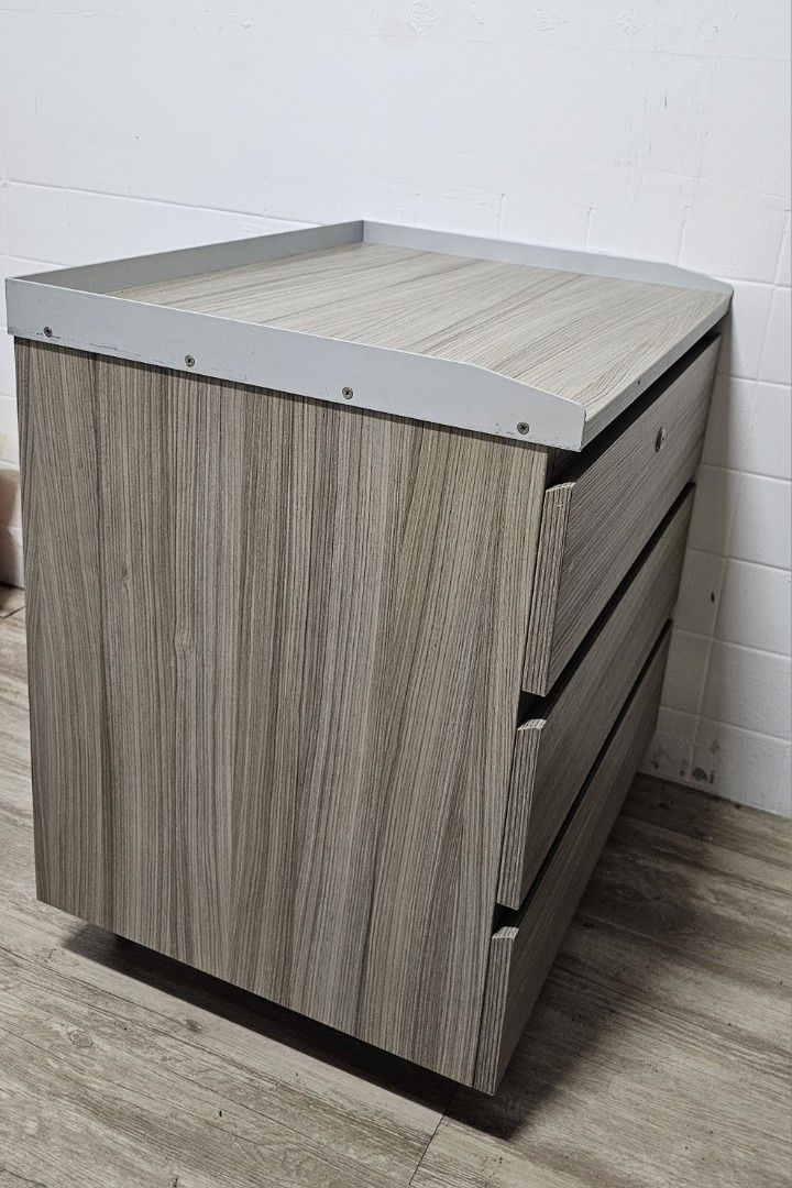 Bedside Table (Category: Shelves, Cabinets & Racks) located in Singapore. Submitted by don.deguzman.25 (Listing ID 1340465602, Image 3). Description: Laminated drawer cabinet Length - 60cm Width - 48cm Height - 67cm.
