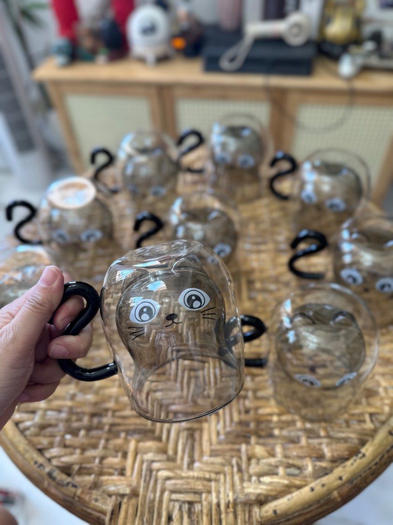 cat double wall glass (Category: Coffee & Tea Tableware) located in Cavite. Submitted by mylittlechicshop (Listing ID 1340296227, Image 3). Description: Super cute Cat Glass ‼️399 glass only ‼️429 with paper bag ✅9 pcs available ❌22 pcs sold This cat mug features an inverted cat design, lifelike, as if a cat is hiding in a cup drinking water. According to the beverage you drink, you will also get cats of different colors. With this cute mug, drin