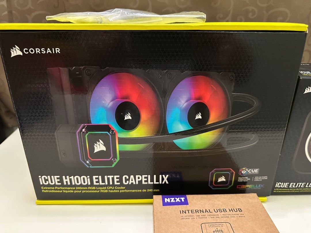 Corsair H100i and Elite LCD (Category: Computer Parts) located in Mandaluyong City. Submitted by kups96 (Listing ID 1340308582, Image 1). Description: Corsair H100i capellix with am4 bracket. Opened only to inspect content. Including Elite LCD upgrade kit and nzxt internal hub. Rfs: did not push through with 2nd pc build. .