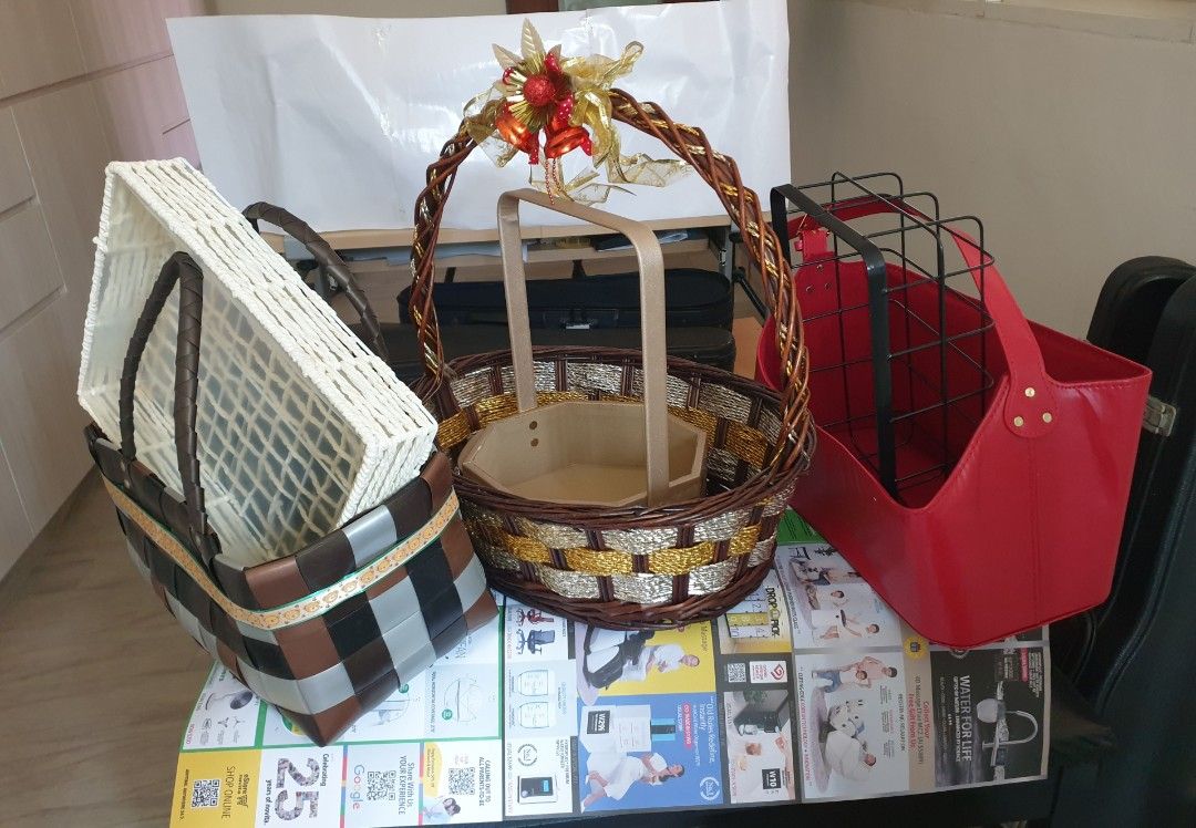 Hamper Baskets (Category: Flowers & Bouquets) located in Singapore. Submitted by koolfossil (Listing ID 1340316821, Image 1). Description: Assortment of hamper baskets for any occasion. Varnished rattan basket, decorated. 42 x 35 x 14cm (depth) $12 Woven PVC basket. 35 x 18 x 17cm (depth) $8 Red PVC/leather basket with felt interior. Base 37 x 20cm $7 Black powdered Steel basket. 31 x 21 x 12cm $5 White rope basket 34 x 26 x6cm $3 Hexagonal reinf