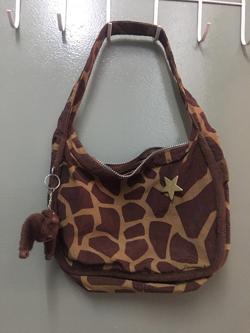 Kipling authentic (Category: Shoulder Bags) located in Kuala Lumpur. Submitted by lara2017 (Listing ID 1340316436, Image 1). Description: Kipling authentic.material nylon.warna brown giraffe printed.tiada lubang Tiada koyak.beg masih bagus dan baik.tinggi 19cm lebar 10cm panjang 28cm.