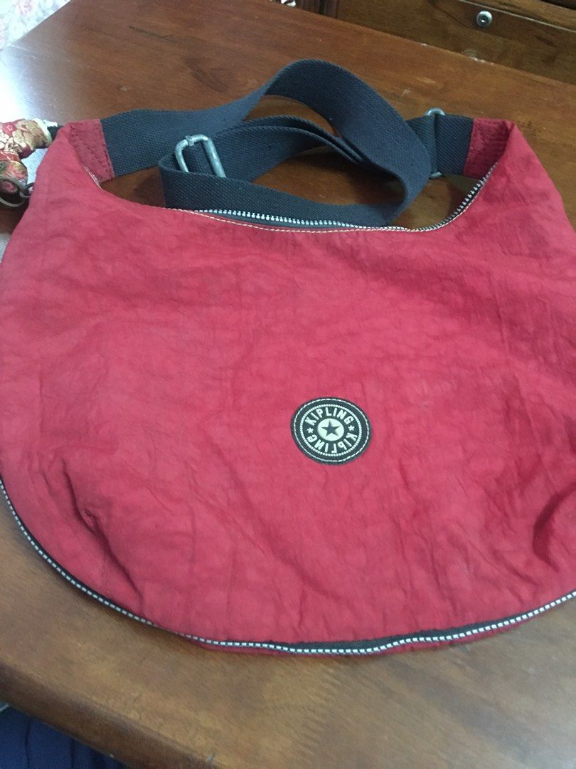 Kipling authentic (Category: Cross-body Bags) located in Kuala Lumpur. Submitted by lara2017 (Listing ID 1340352889, Image 2). Description: Kipling authentic.material nylon.warna merah.tali sling boleh laras.Tiada lubang Tiada koyak.beg masih bagus dan baik.expandable this beg.tinggi 28cm lebar 9cm panjang 37cm.