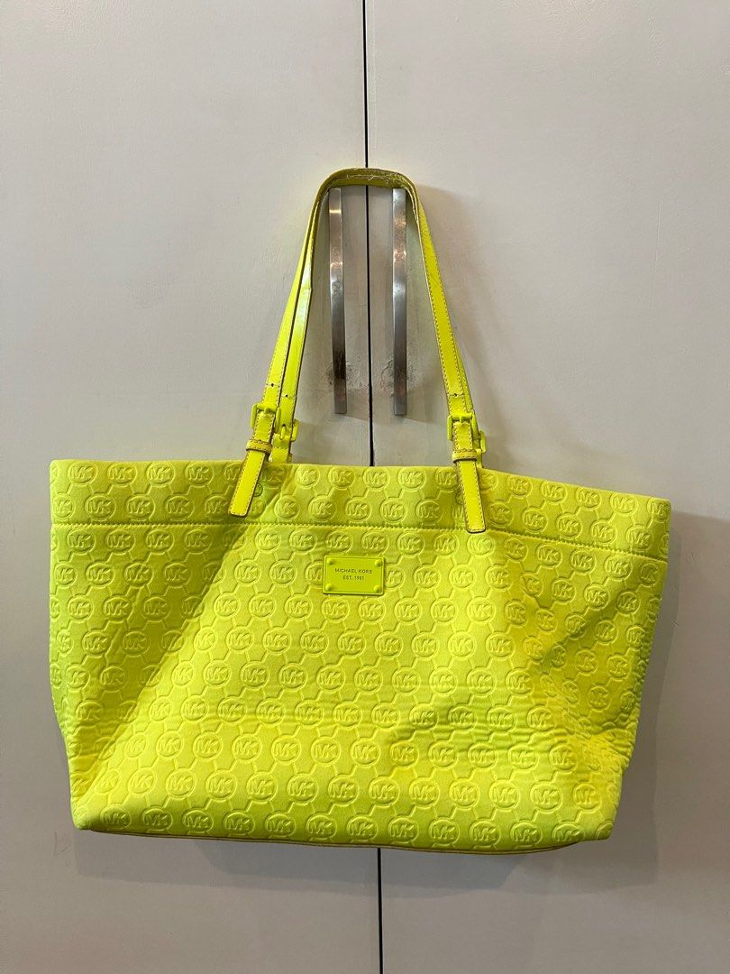 Michael Kors Neoprene Tote Bag (Category: Tote Bags) located in Marikina City. Submitted by hansclosetfinds (Listing ID 1340370276, Image 1). Description: Michael Kors neoprene tote bag in neon yellow Original MK bag With signs of wear in the straps; can wrap a scarf to cover wear Steal price at Php 500! RFS: decluttering .