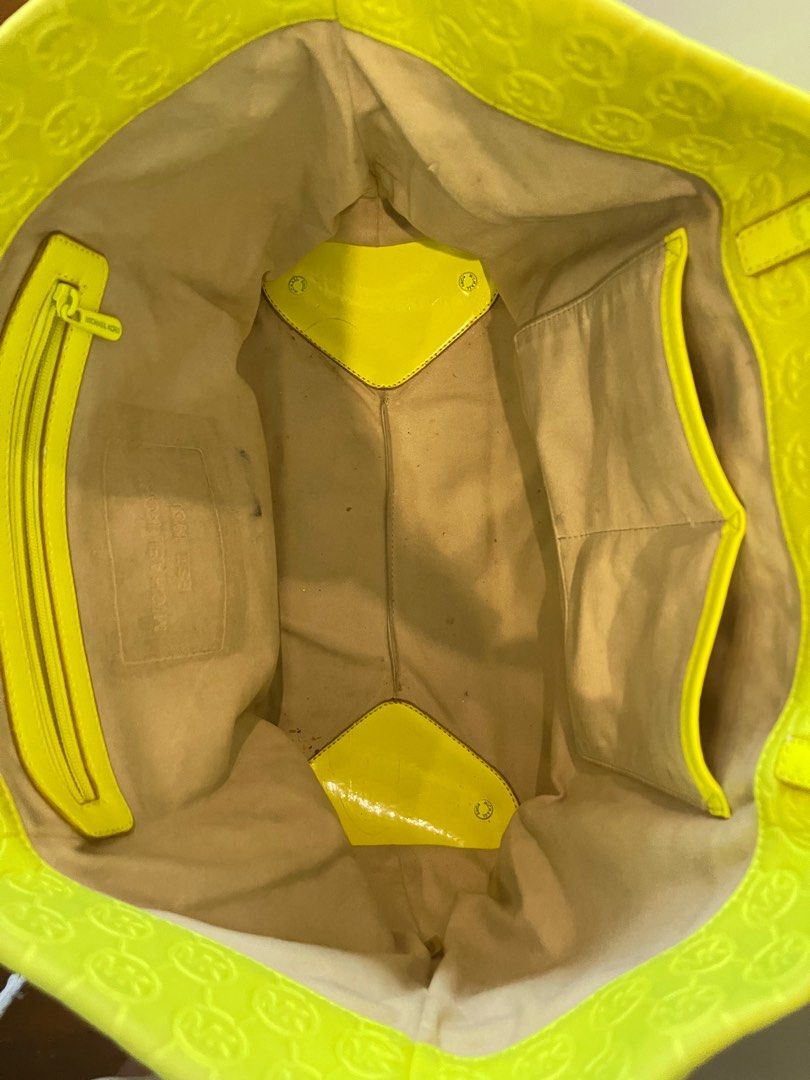 Michael Kors Neoprene Tote Bag (Category: Tote Bags) located in Marikina City. Submitted by hansclosetfinds (Listing ID 1340370276, Image 3). Description: Michael Kors neoprene tote bag in neon yellow Original MK bag With signs of wear in the straps; can wrap a scarf to cover wear Steal price at Php 500! RFS: decluttering .