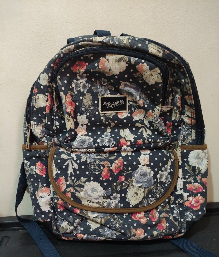 Original Ruffles Flora pattern navy blue Backpack (Category: Backpacks) located in Rodriguez. Submitted by starpreloveditems (Listing ID 1340350232, Image 1). Description: - Used for school for 2 years. -Comes with a matching pencil pouch. -No flaws -Good condition MoP: Gcash.