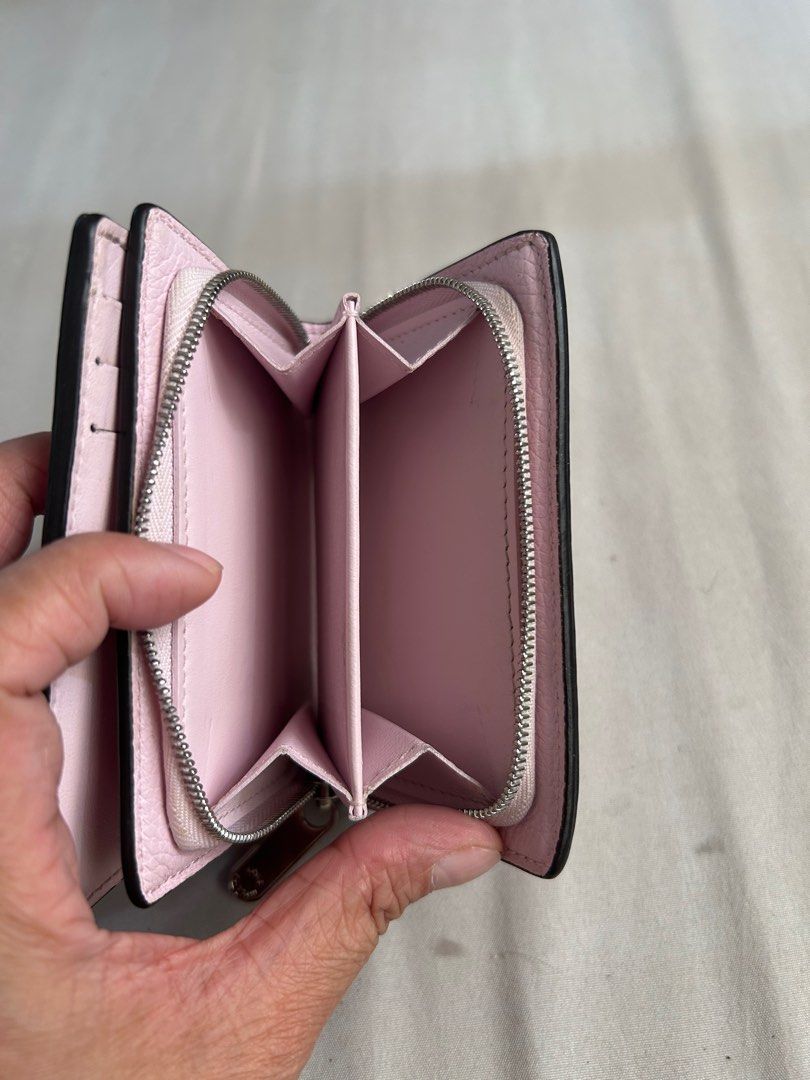 Authentic LV Mahina Bifold wallet (Category: Luxury Bags & Wallets) located in Dinalupihan. Submitted by hydzsalva (Listing ID 1340493803, Image 3). Description: Authentic LV Mahina Bifold Wallet flaw - with initials and snap is kinda loose but still functional thus selling for only 20% of the original price.