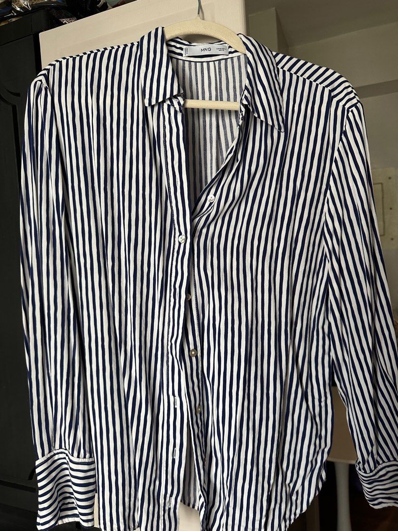 MANGO Long Sleeves Blue Stripes Office Wear Size Medium (Category: Longsleeves) located in Mandaluyong City. Submitted by chiacells (Listing ID 1340543410, Image 1). Description: rfs: di bagay sakin. naeenphasize ng stripes yung large bust ko 💀.