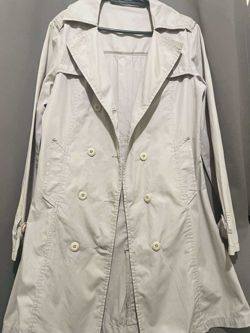 RRJ Double-breasted classic trench coat (Category: Coats, Jackets and Outerwear) located in Rizal. Submitted by oncelovedbysherry (Listing ID 1340511079, Image 2). Description: Beige double-breasted trench coat with wide lapels and 2 working pockets. Lightweight. Classic trench coat styling with adjustable straps on the sleeves. Bought this in the physical store. Never used. RFS: Too tight in my arms 🥲 SF will be shouldered by buyer. Length: 33 