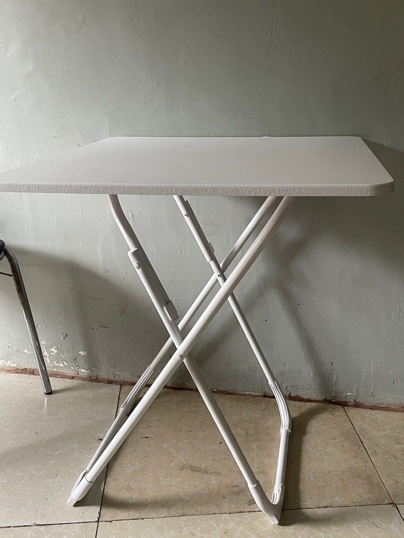 White Nordic Foldable Dining Table (Category: Tables & Sets) located in Las Pinas. Submitted by btanbae (Listing ID 1340534082, Image 1). Description: Newly bought at 938 pesos RFS: Has small dent upon receiving and smaller than expected LxWxH: 80*80*74cm.
