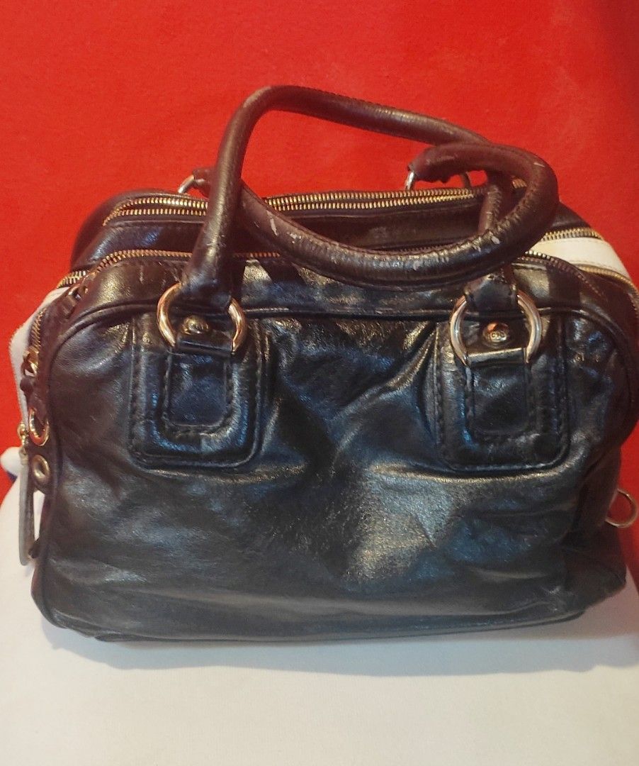 Authentic Dolce & Gabbana "Bag Lily" (Category: Luxury Bags & Wallets) located in Las Pinas. Submitted by lawki_stuff (Listing ID 1340679797, Image 1). Description: 👉Very rare & limited edition D&G LILY Bag high quality & exclusive design 👉Authentic 💯 leather 👉Divided into 3 compartment with 4 zipper pull 👉Gold studs at the bottom 👉Inside zipper pocket 👉Interior is clean & no visible spots 👉The only issue is the handle with stain or scrat