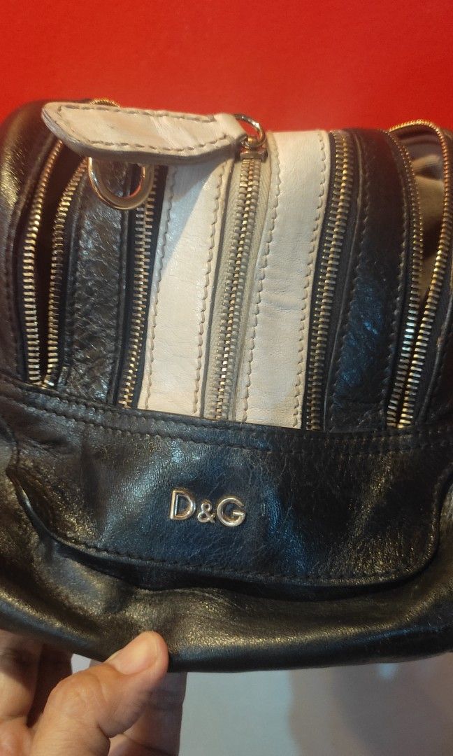 Authentic Dolce & Gabbana "Bag Lily" (Category: Luxury Bags & Wallets) located in Las Pinas. Submitted by lawki_stuff (Listing ID 1340679797, Image 3). Description: 👉Very rare & limited edition D&G LILY Bag high quality & exclusive design 👉Authentic 💯 leather 👉Divided into 3 compartment with 4 zipper pull 👉Gold studs at the bottom 👉Inside zipper pocket 👉Interior is clean & no visible spots 👉The only issue is the handle with stain or scrat
