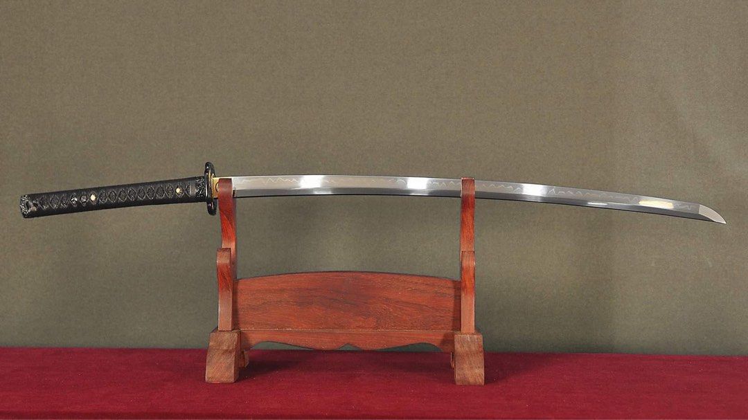 Ghost of Tsushima Katana (Category: Combat Sports) located in Manila. Submitted by rexngaw (Listing ID 1340752469, Image 1). Description: Ghost of Tsushima Katana -Exact replica of Jin Sakai’s katana except in all black -1095 HC DH Steel -Leather Tsukaito (handguard) -only used for display purposes -repainted tsuba (handguard) -will include double katana display stand -forged and imported from Thailand.