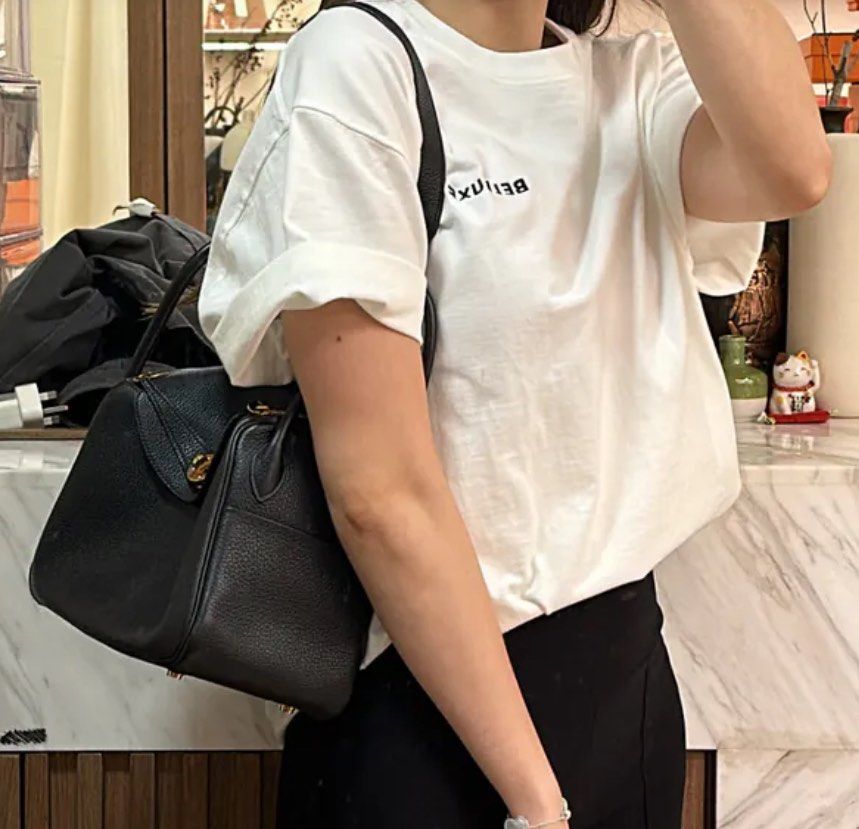 Hermes Lindy 26 Noir GHW (Category: Luxury Bags & Wallets) located in Quezon City. Submitted by __12345 (Listing ID 1340844414, Image 1). Description: - Preorder (2 weeks eta) - 9.5/10 condition - Stamp Y - Includes dustbag, box, and certificate of authenticity - Available for meet ups/delivery - Detailed photos available upon request - Guaranteed authentic or money back! Open to sourcing requests! Send us a message 💌🛍️.