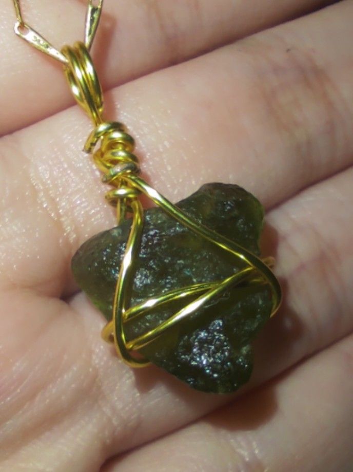 Moldavite pendant. (.85g) Check description box for more info. (Category: Charms) located in Cavite. Submitted by archivesnishei (Listing ID 1340813569, Image 3). Description: Moldavite pendant this piece is pretty big, I think nasa around .85 grams siya. The chain is not included po. pm for more deets :) Moldavite is known as the 'stone of transformation' and its high vibration energy is believed to greatly accelerate spiritual growth and evolut
