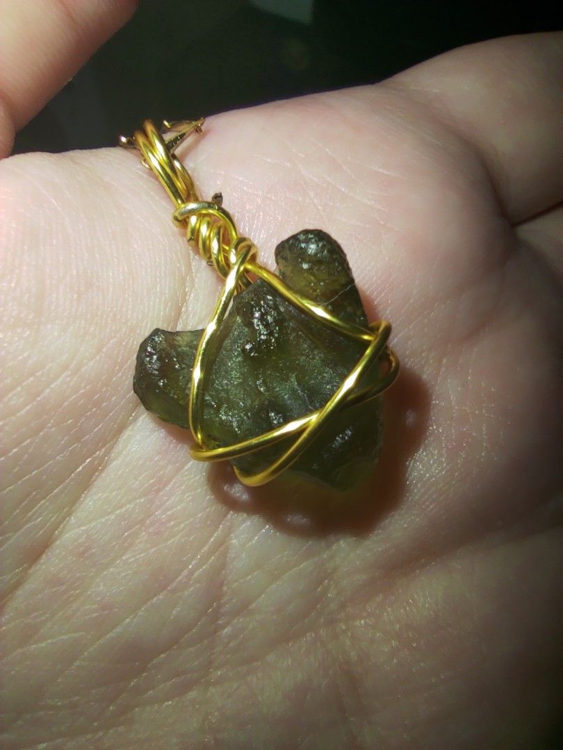 Moldavite pendant. (.85g) Check description box for more info. (Category: Charms) located in Cavite. Submitted by archivesnishei (Listing ID 1340813569, Image 2). Description: Moldavite pendant this piece is pretty big, I think nasa around .85 grams siya. The chain is not included po. pm for more deets :) Moldavite is known as the 'stone of transformation' and its high vibration energy is believed to greatly accelerate spiritual growth and evolut