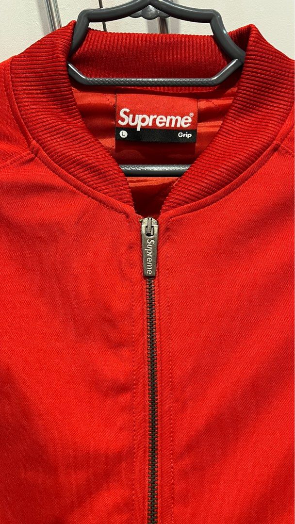 Supreme Grip bomber jacket red (Category: Coats, Jackets and Outerwear) located in Imus. Submitted by uncertainty (Listing ID 1340756411, Image 3). Description: Like new but was never used outside so its 99% fresh. Bought in Dubai as pasabuy, but didn’t fit me. Size is L but I think this fits Medium. Can do shipping or meetup in Imus/Bacoor only. 21x24in Clean stitches, no stain.