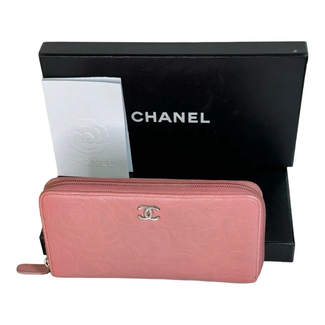 Authentic chanel Camellia zippy (Category: Luxury Bags & Wallets) located in Quezon City. Submitted by manerarestorationservices (Listing ID 1283585181, Image 1). Description: Selling for only 🔥🔥🔥13,800🔥🔥🔥 ✅ Money back Guarantee 💯% Guaranteed authentic *Brand: CC Camellia Embossed Zippy ---MISSING HOLO--- *Materials: Lambskin leather *Color: power pink *Size: Long Compact *Condition: 8/10 never been spa Need mild cleaning -Used * Inclusion