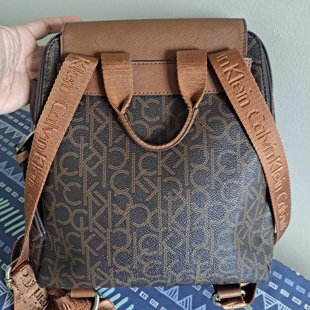 Calvin Klein Monogram Small Backpack (Category: Luxury Bags & Wallets) located in Batangas. Submitted by lynmejlight (Listing ID 1283483340, Image 2). Description: Original CK Small Monogram Backpack. Makinis ang body at loob. Madami compartment kahit maliit. Sign of used sa hardwares at sa side part ng bag. Un ngkaro ng cut pero kinapit na xa. See last 3 photos..